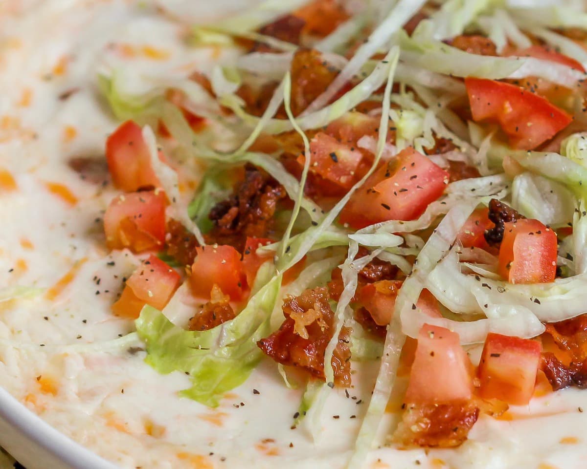 Super Bowl Appetizers - BLT dip topped with shredded lettuce, chopped bacon and diced tomatoes. 