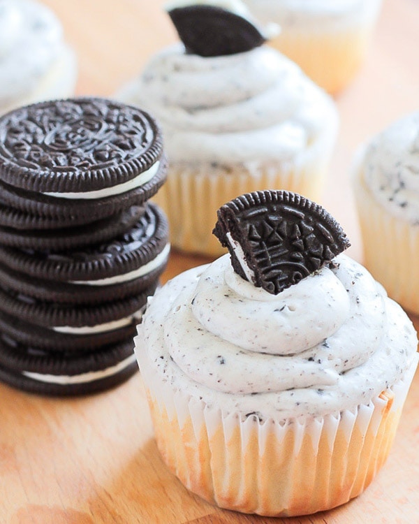 Cookies and Cream Cupcakes topped with a piece of Oreo