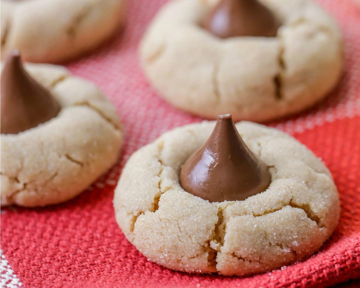 peanut butter blossom cookies on a red dish towel