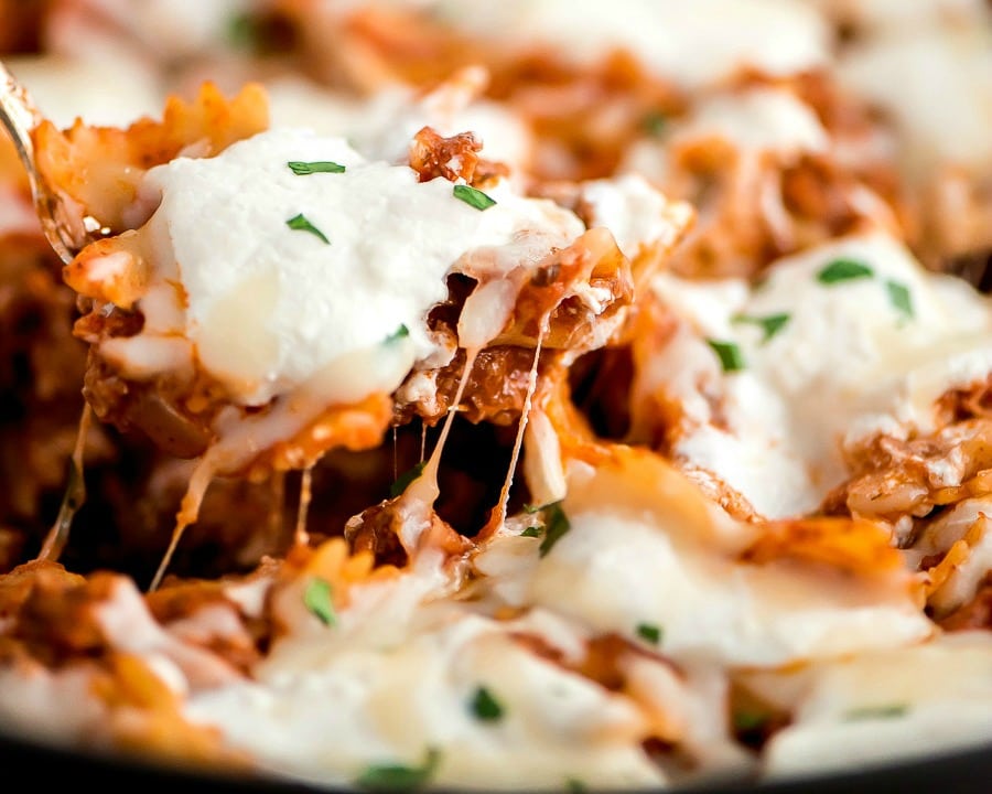 Quick dinner ideas - scoop of skillet lasagna topped with cheese.