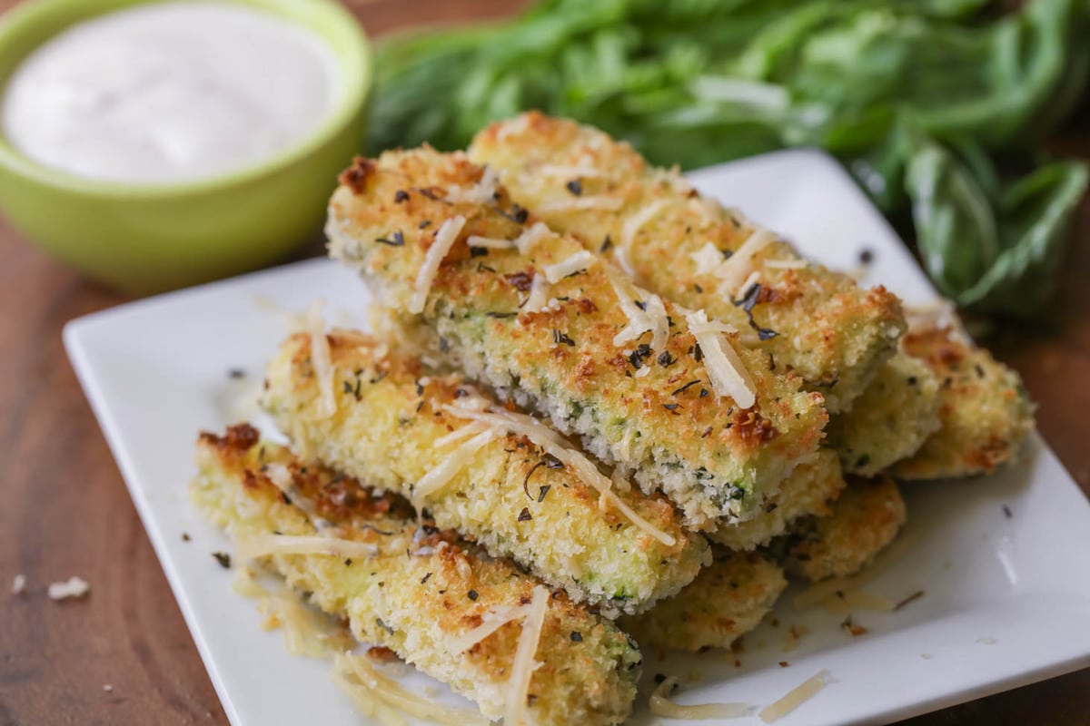 Easy side dishes - baked zucchini fries piled on a plate.