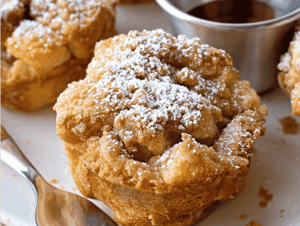 French Toast muffins close up image with powdered sugar on top.