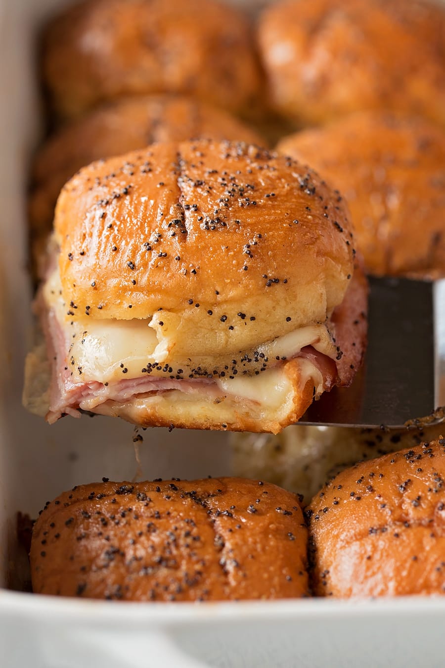 Hot Hawaiian Ham and Cheese Slider on a spatula.