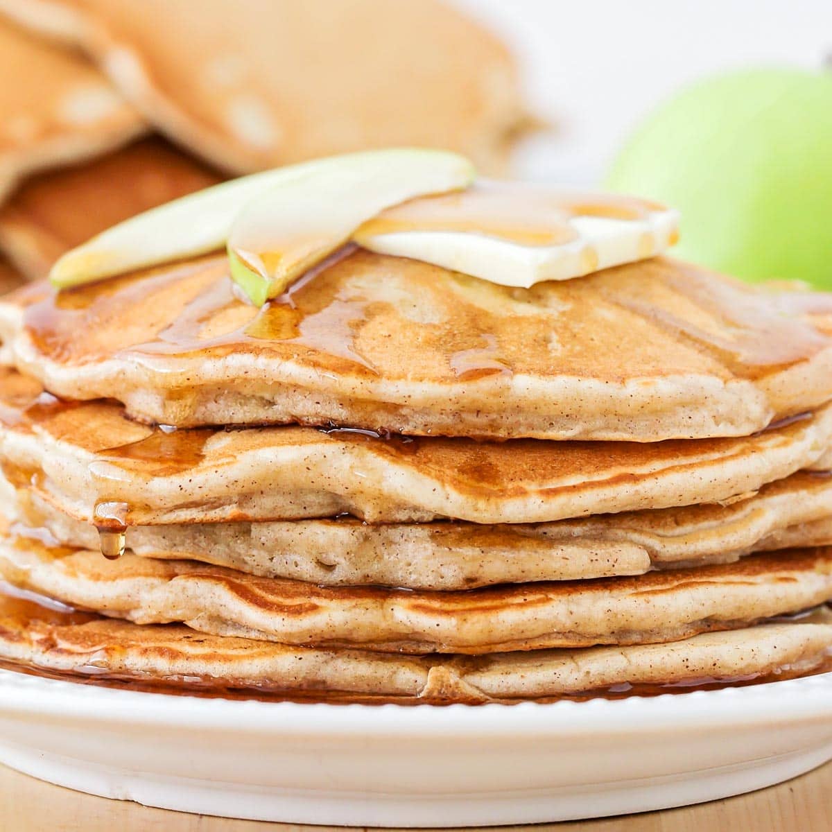 Close up image of stack of apple cinnamon pancakes