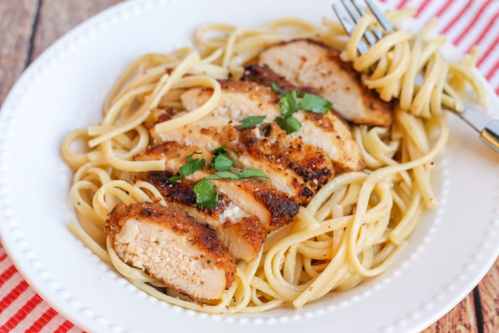Chicken Breast Recipes - A bowl of pasta topped with chicken scallopini.
