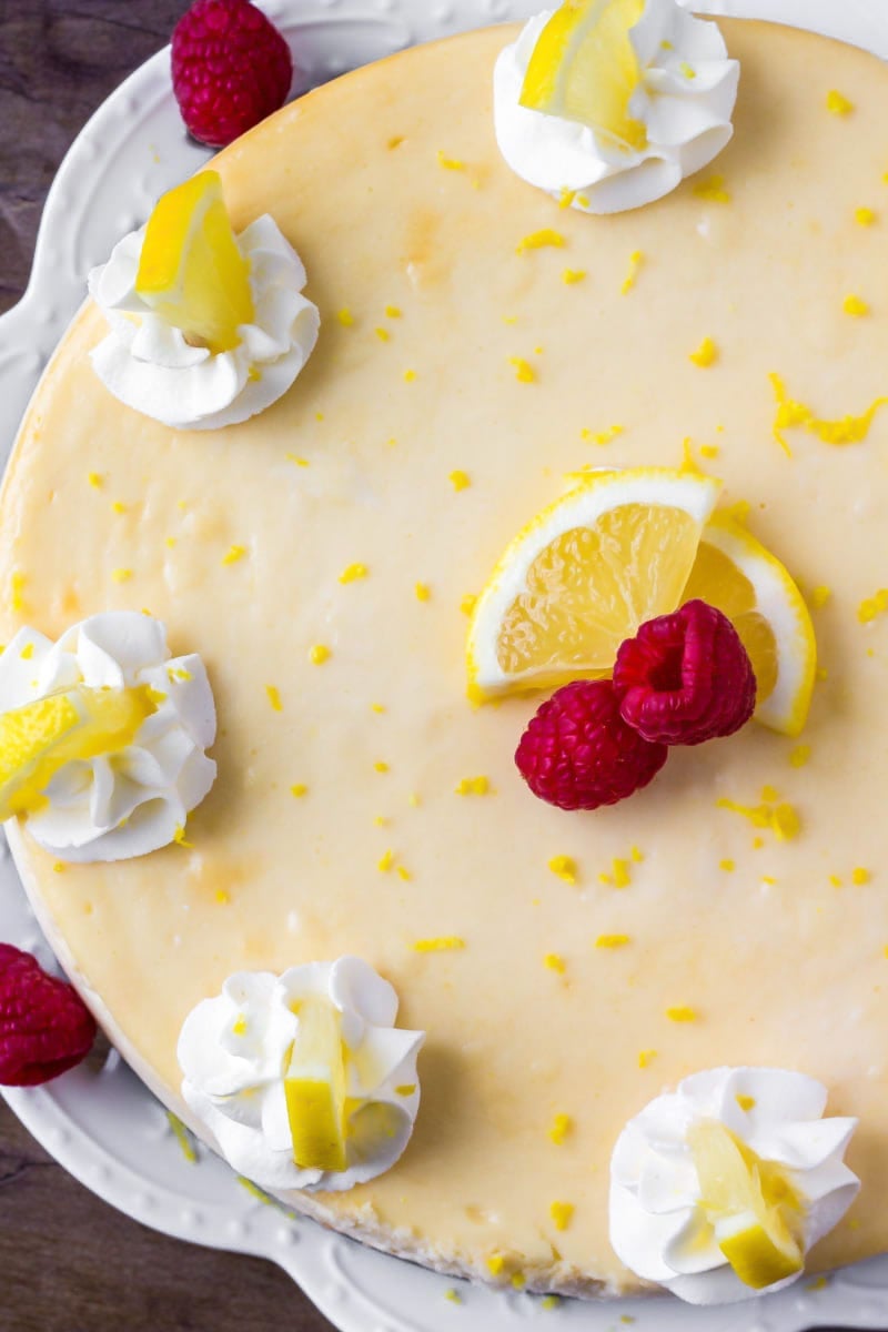 Whole Lemon Raspberry Cheesecake on a serving platter