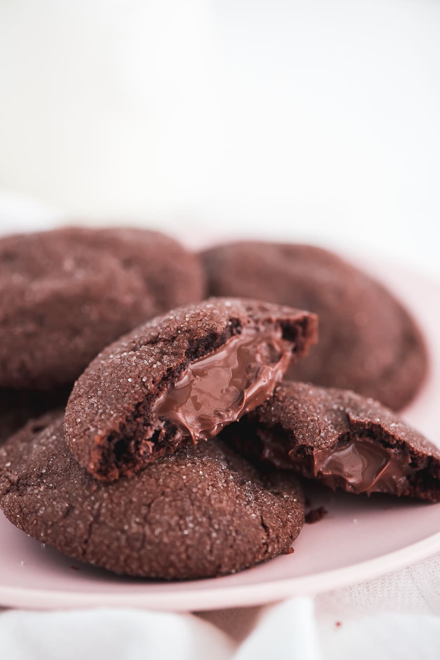 Stack of nutella cookies on a white plate.