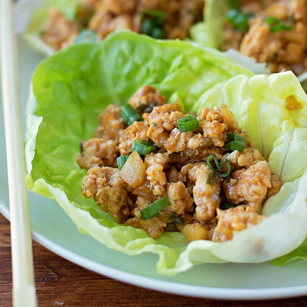 Asian Dinner Recipes - Chicken Lettuce Wraps on a light blue plate. 