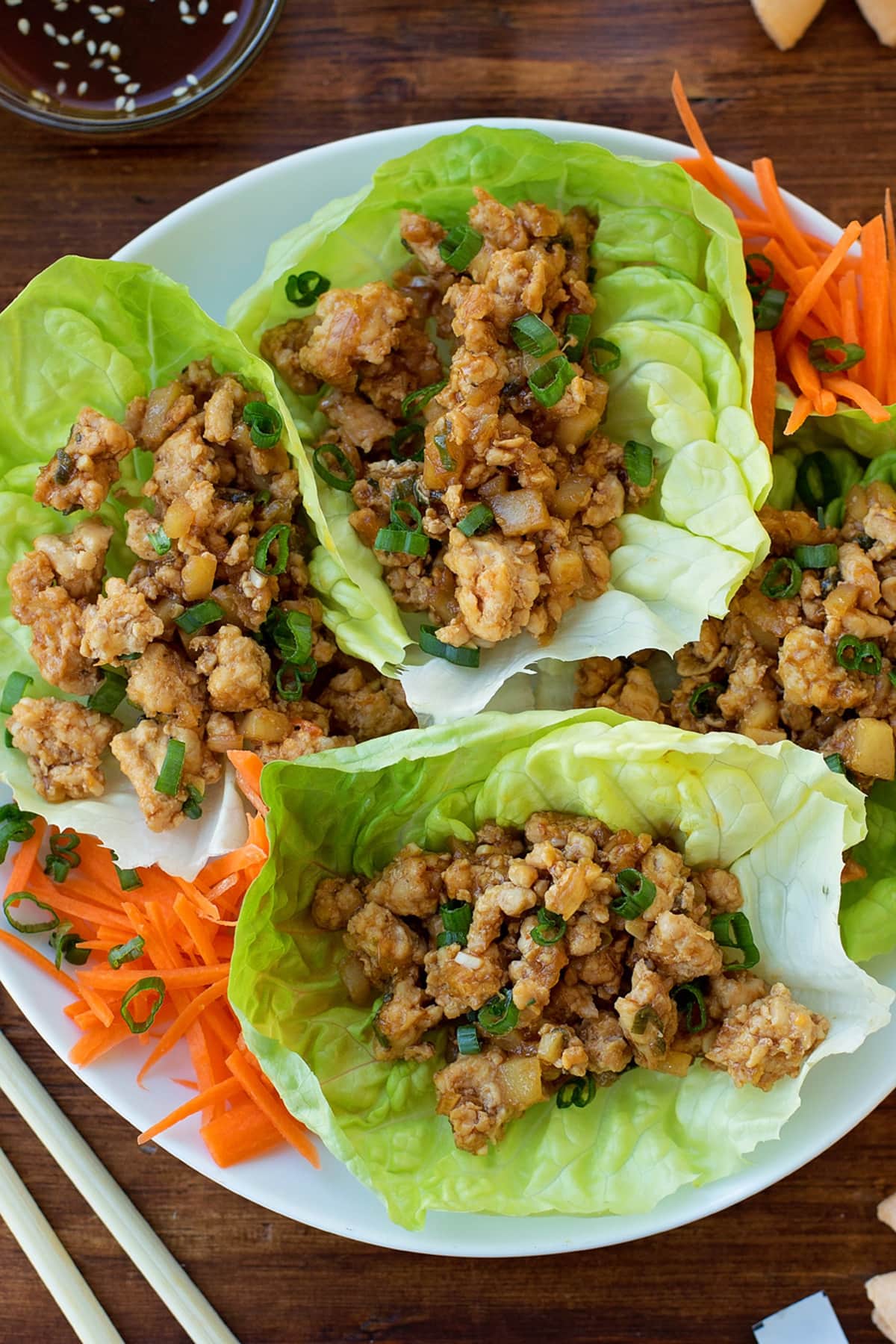 PF Changs Chicken Lettuce Wraps on a plate with shredded carrots