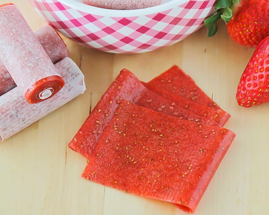 Cut fruit leather recipe wrapped and packaged in parchment paper.