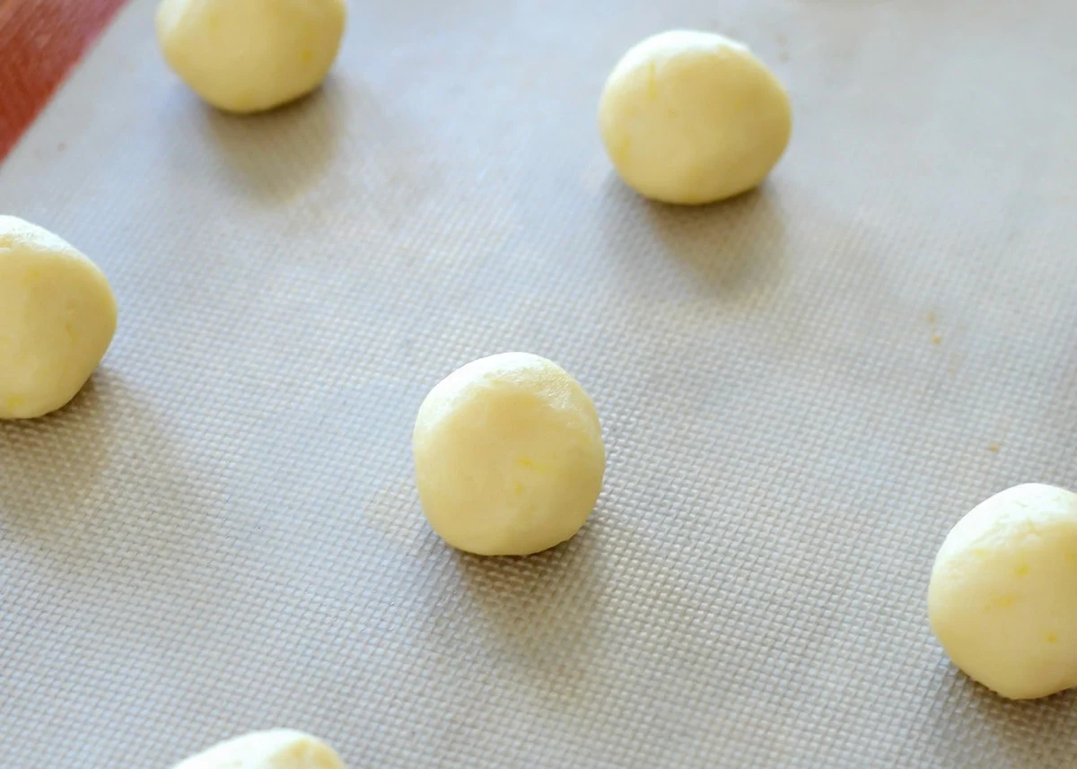 Lemon sugar cookie dough balls ready to bake.