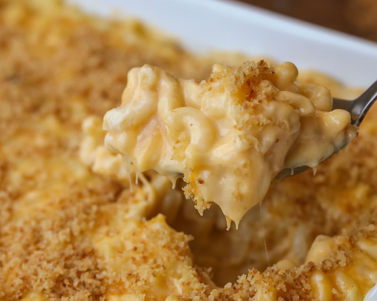 Homemade Mac and Cheese on spoon in casserole dish