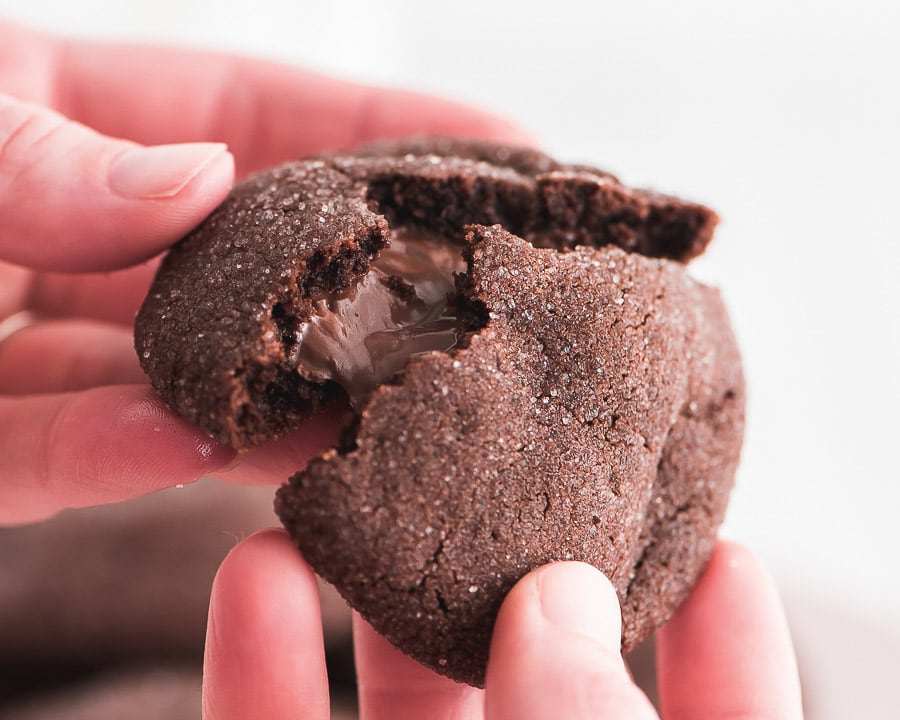 Valentine's Day Desserts - Chocolate Nutella filled cookie being broken apart. 