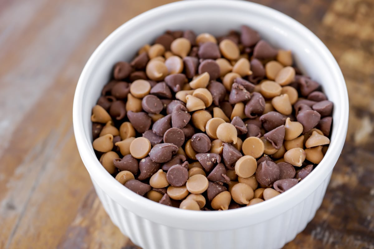 Milk chocolate and butterscotch chips in bowl.