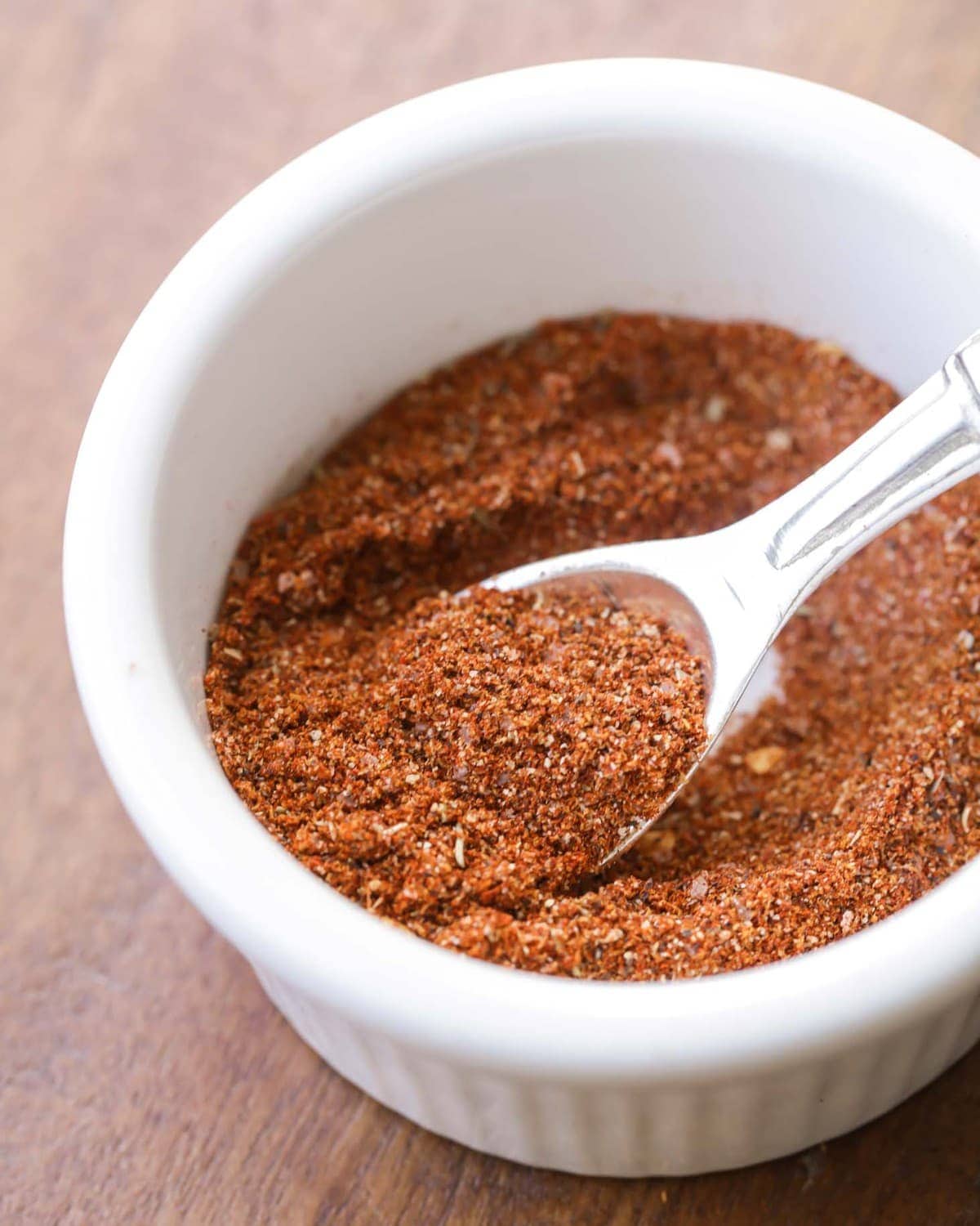 DIY Taco Seasoning Recipe stored in a white bowl.