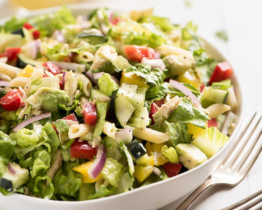 Green Salad Recipes - Closeup of tuna salad in a white bowl. 