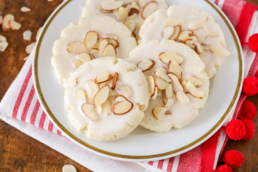 Almond cookies on white plate for Christmas cookies collection.
