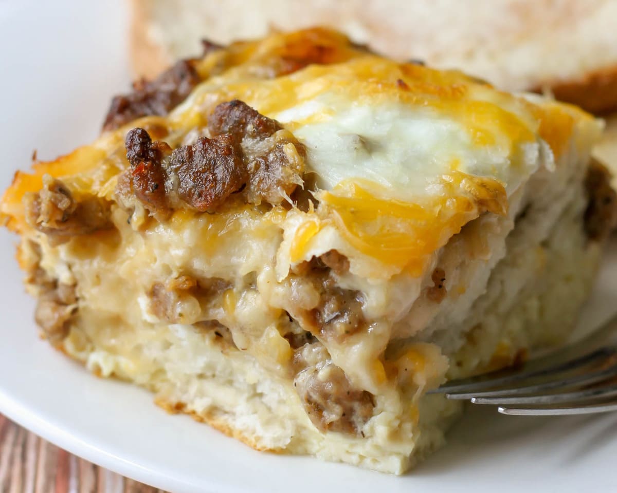 A slice of biscuit egg casserole on a white plate. 