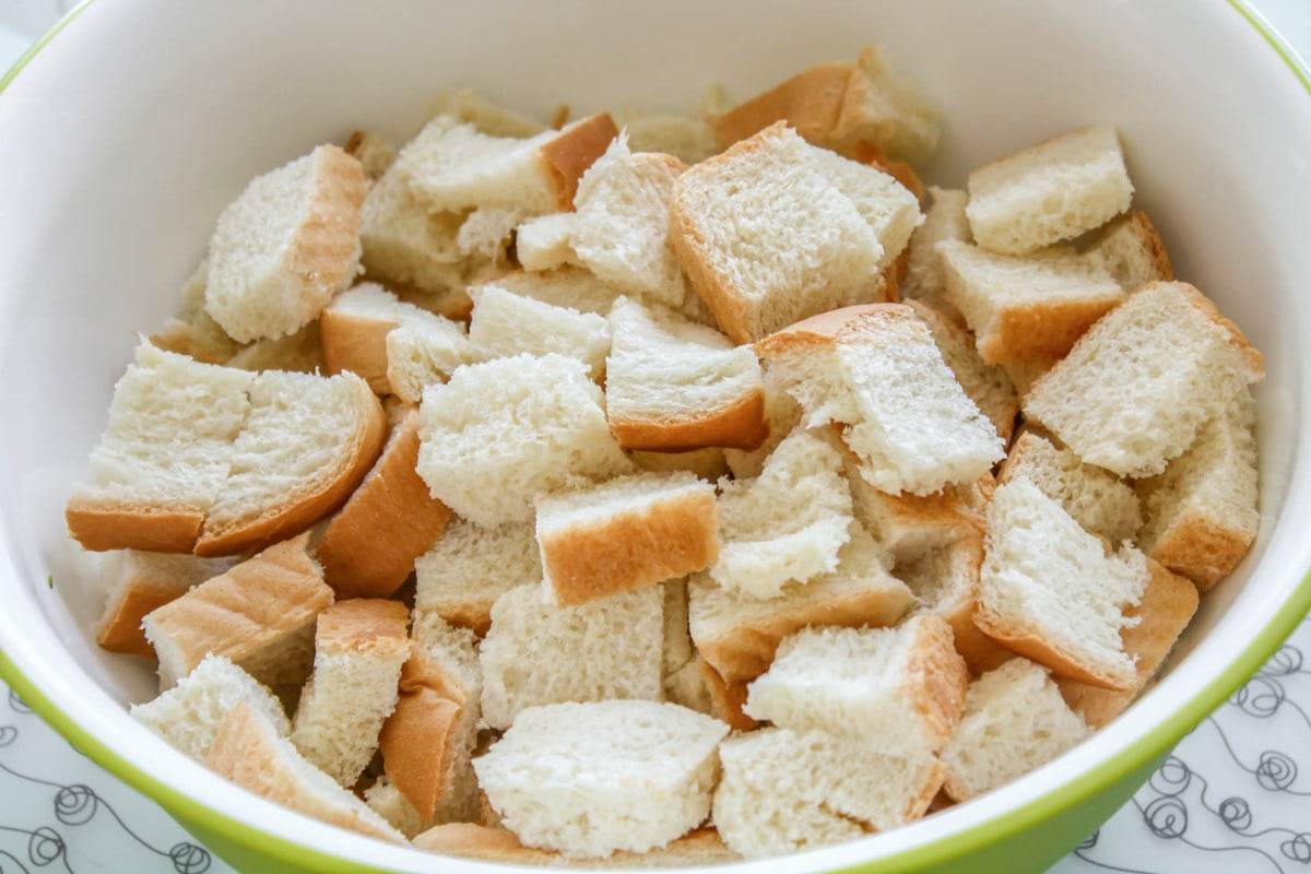 Cut up bread for Strata recipe.