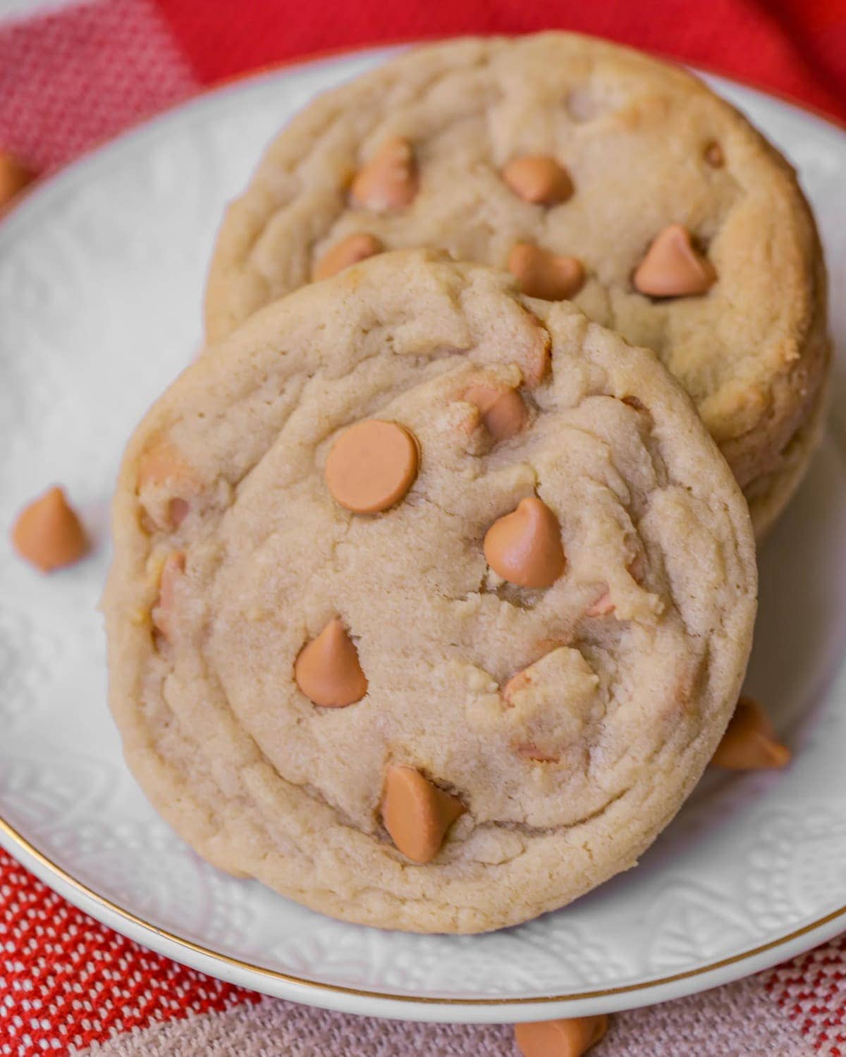 Close up of stacked Butterscotch Cookies on a white plate.