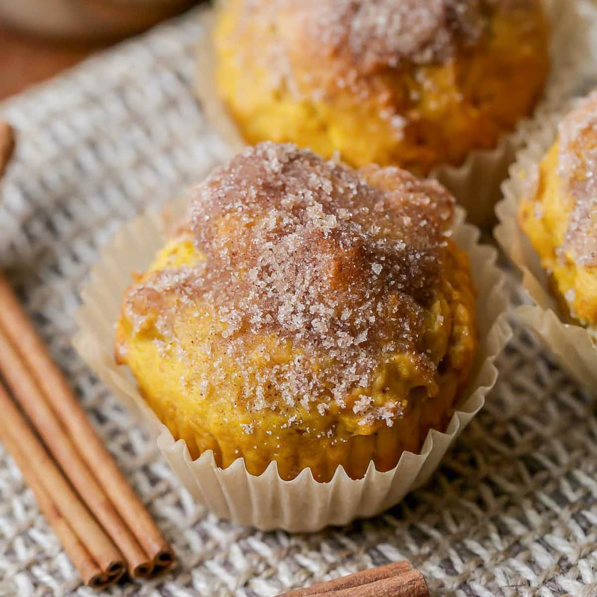 Pumpkin muffins topped with cinnamon and sugar