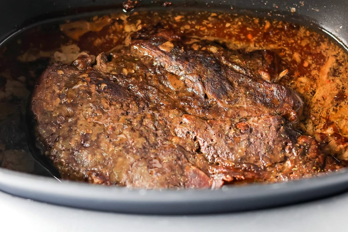 Crock pot roast in slow cooker.