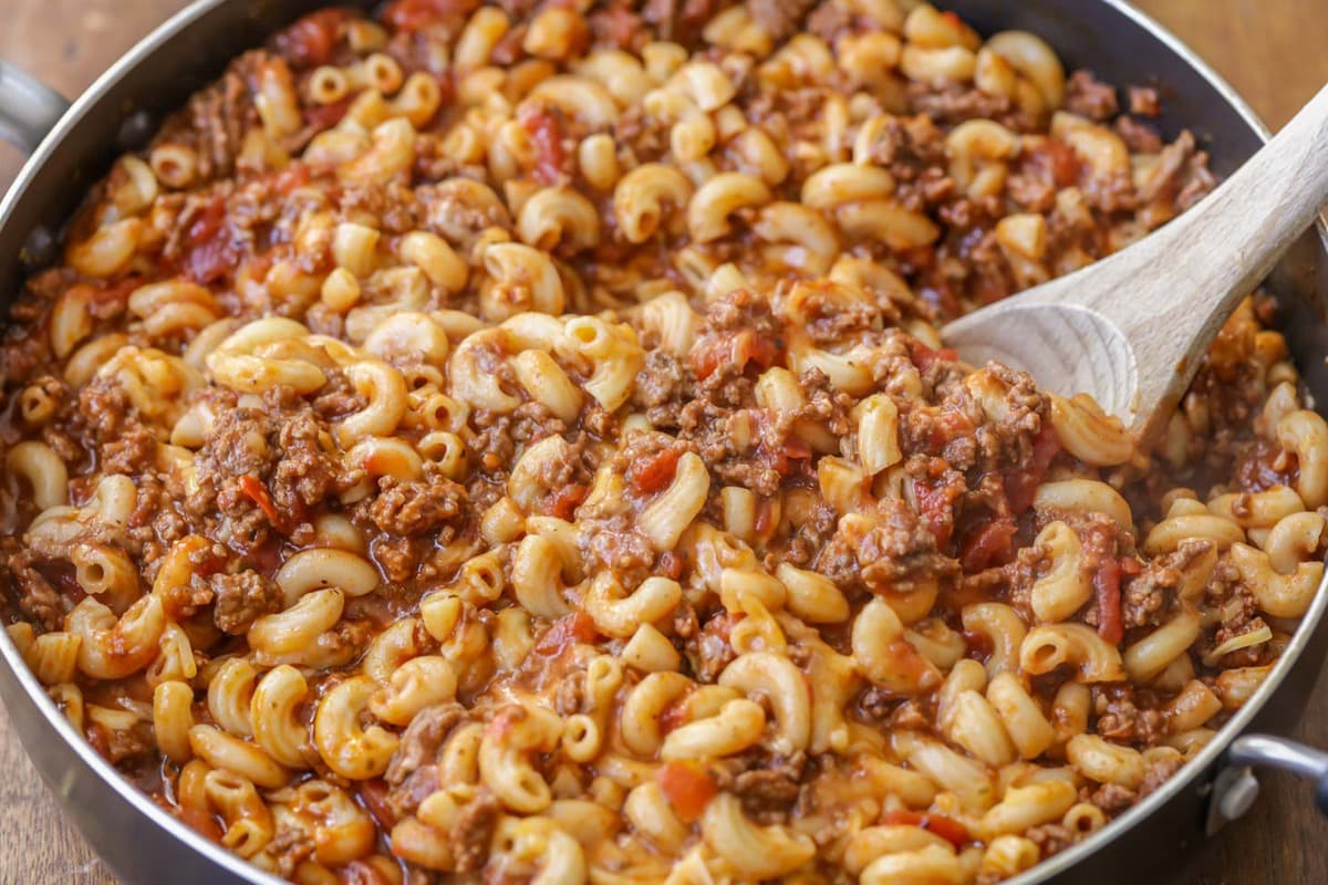 Beef Goulash cooking in a skillet.