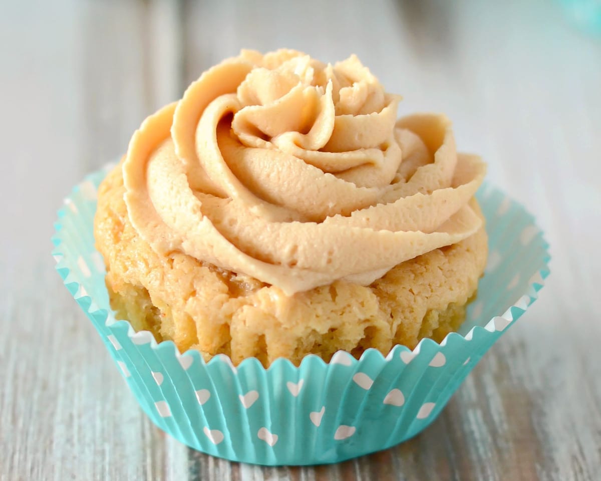 Peanut Butter Cupcakes on a wooden table.