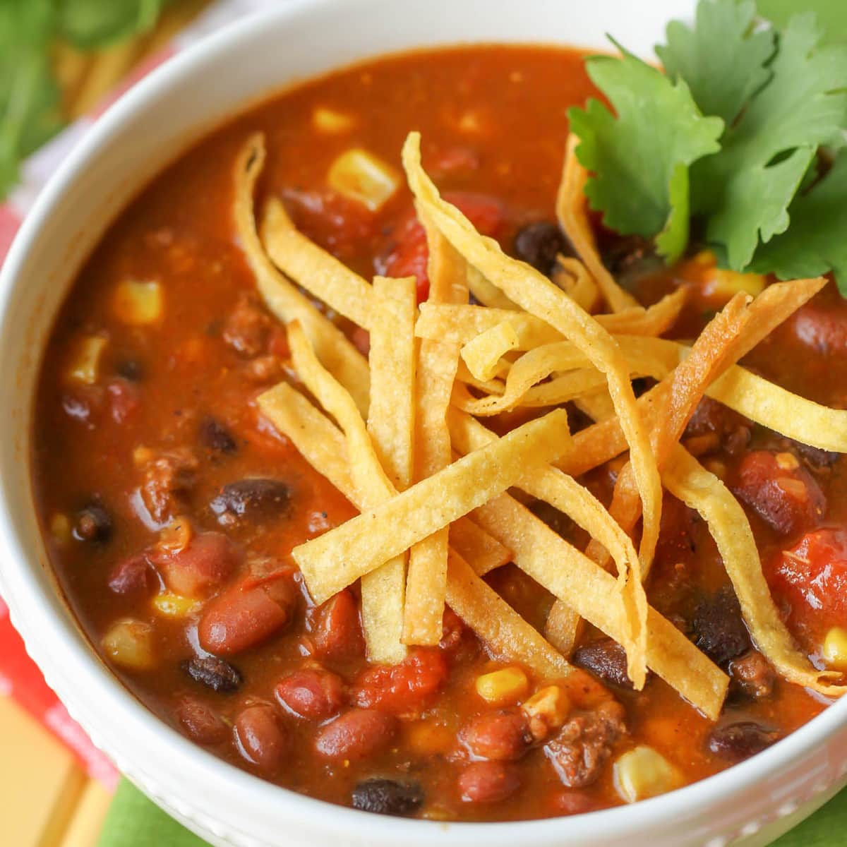 Mexican Christmas food - taco soup topped with tortilla strips and fresh cilantro.