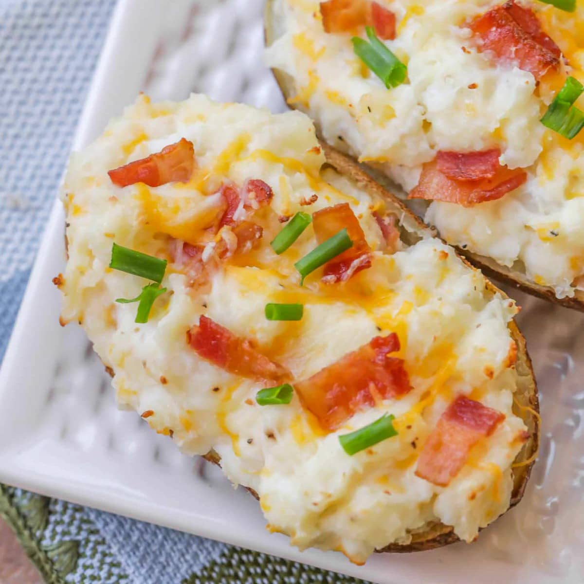 Easy side dishes - 2 easy twice baked potatoes topped with bacon and green onions.