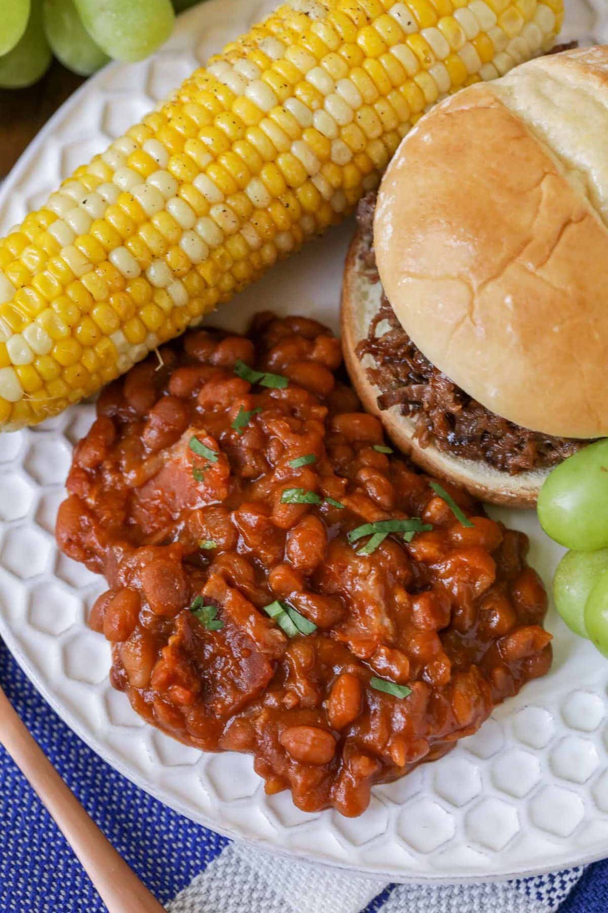 Homemade Baked Beans Recipe served with Pulled Pork sandwiches.