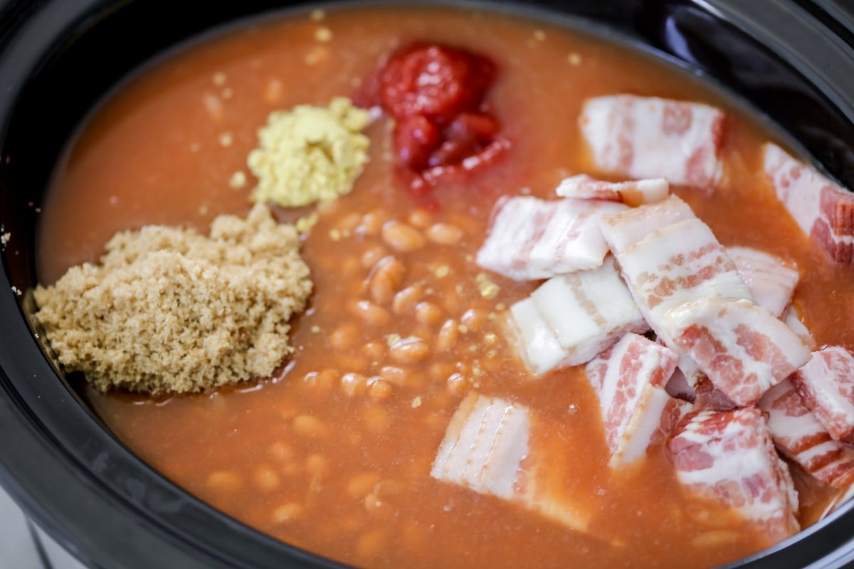 Crockpot baked beans cooking in slow cooker.