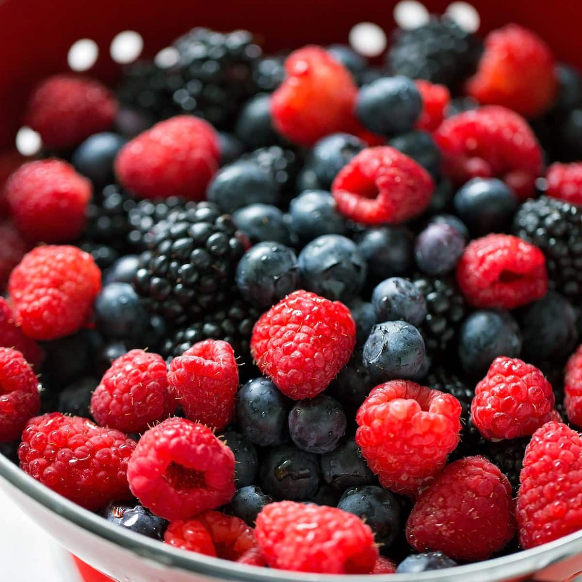 Raspberries, blackberries, and blueberries for berry frosting