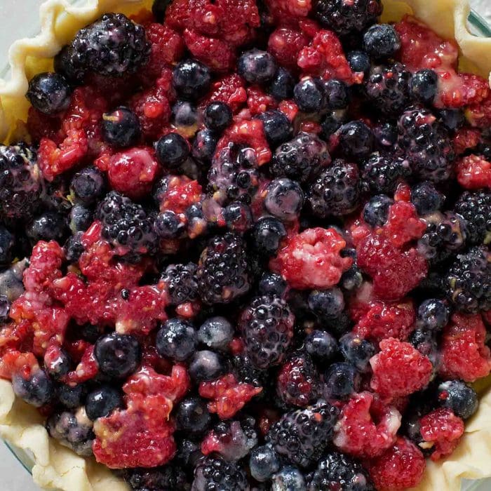 Berry pie filling mixed and placed in a pie crust.