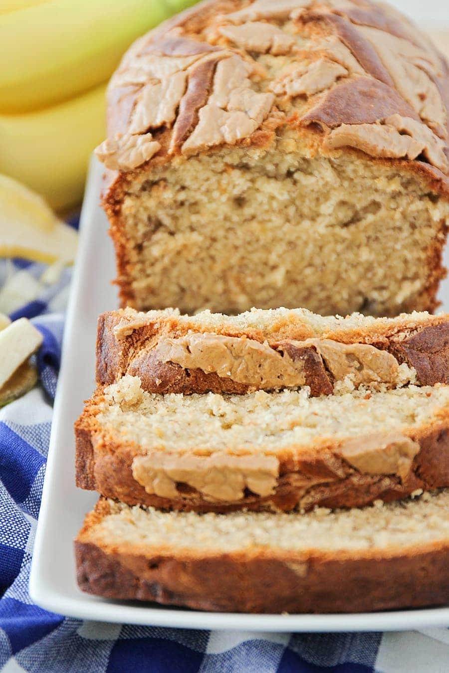 Peanut Butter Banana Bread sliced and served on a white plate.