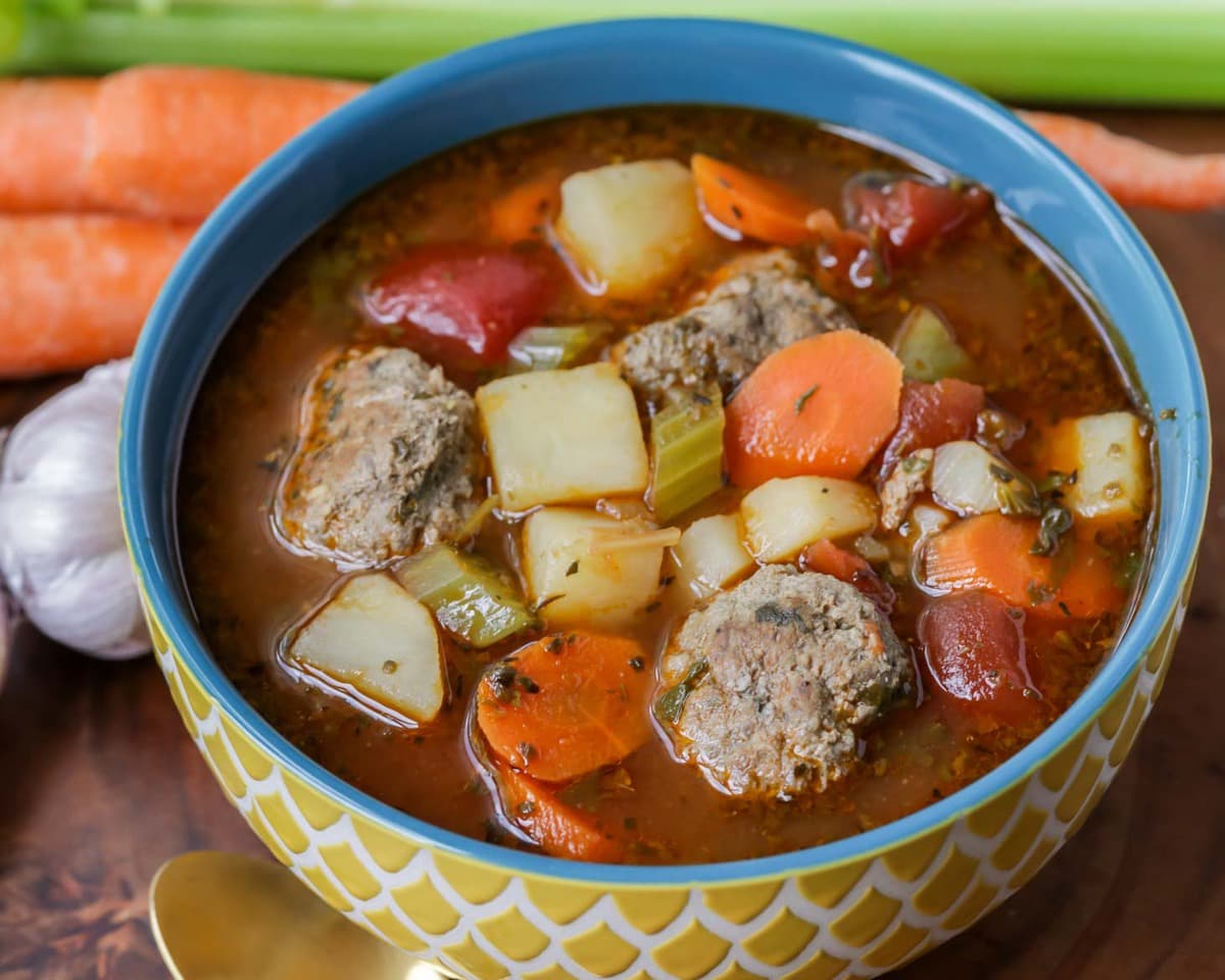 Fall soup recipes - close up of albondigas soup filled with veggies.