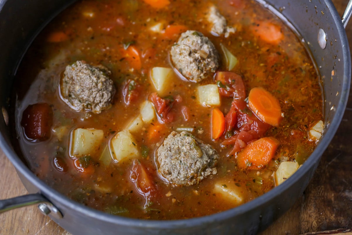 A soup pot filled with albondigas soup.