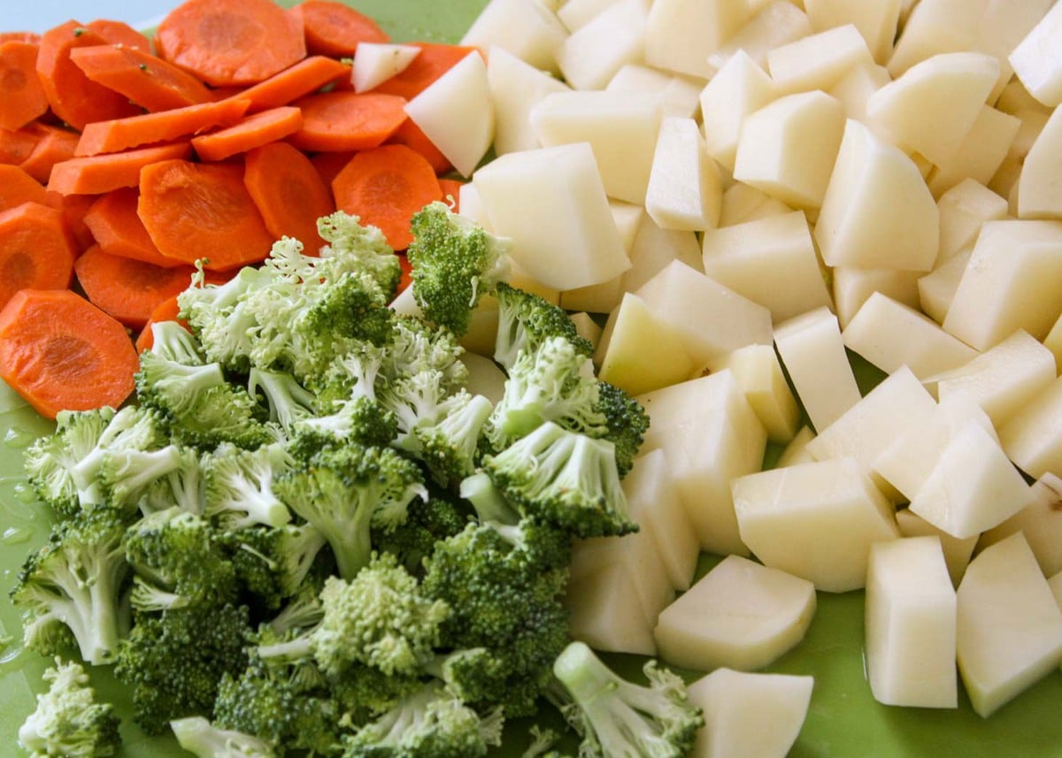 Chopped veggies for loaded broccoli potato cheese soup.