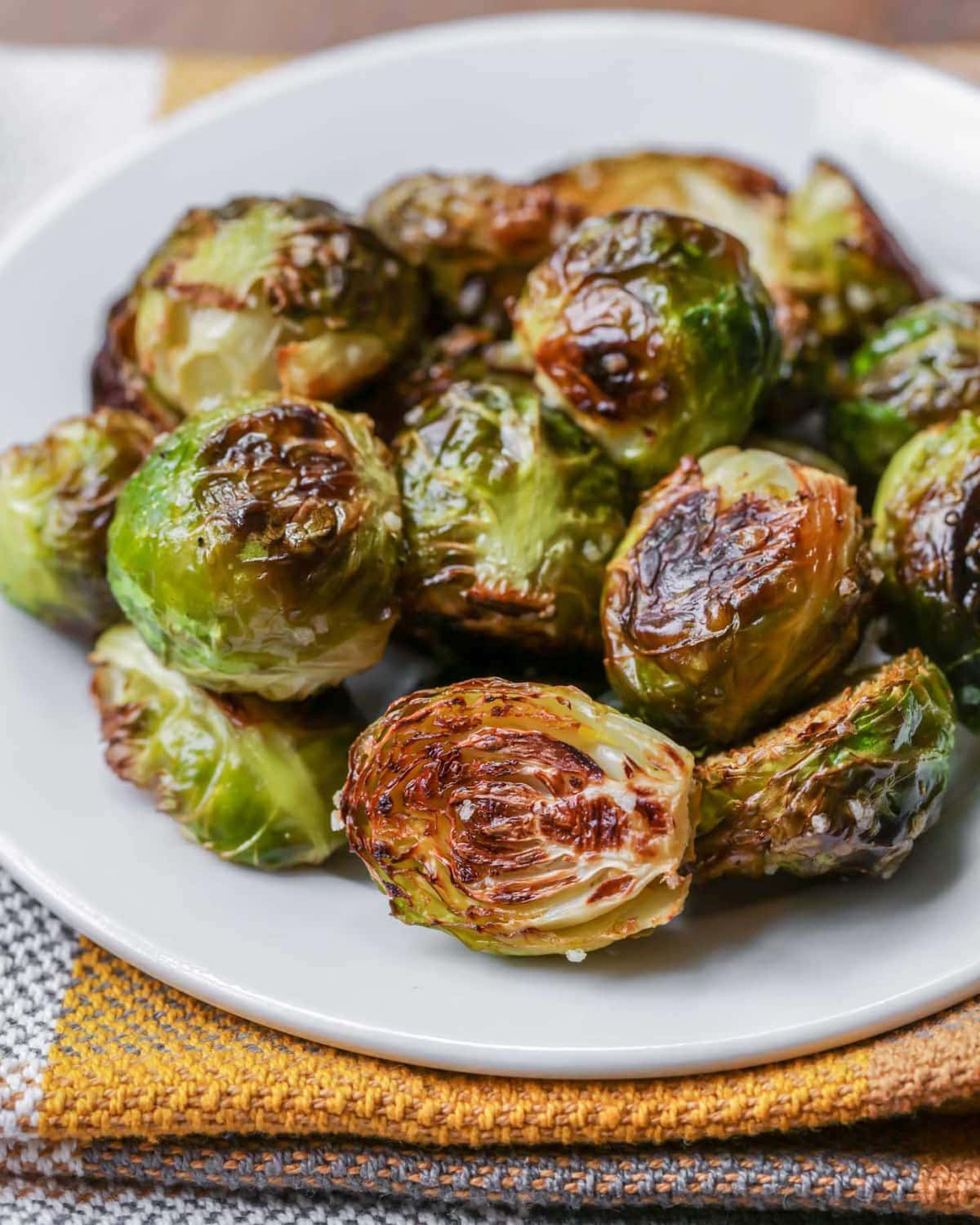 Roasted Brussel Sprouts closeup on white plate.