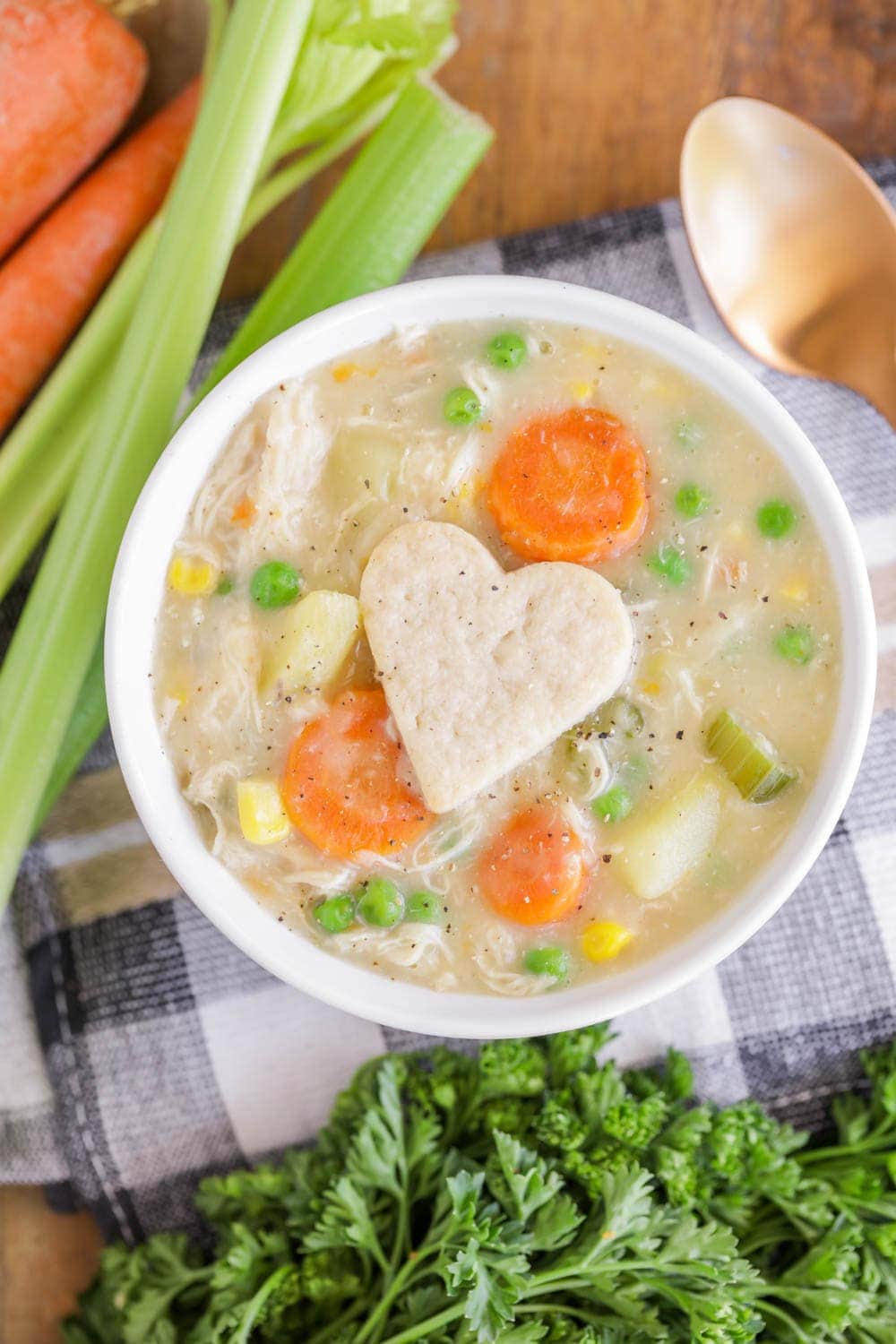 Chicken pot pie soup recipe served in a white bowl.