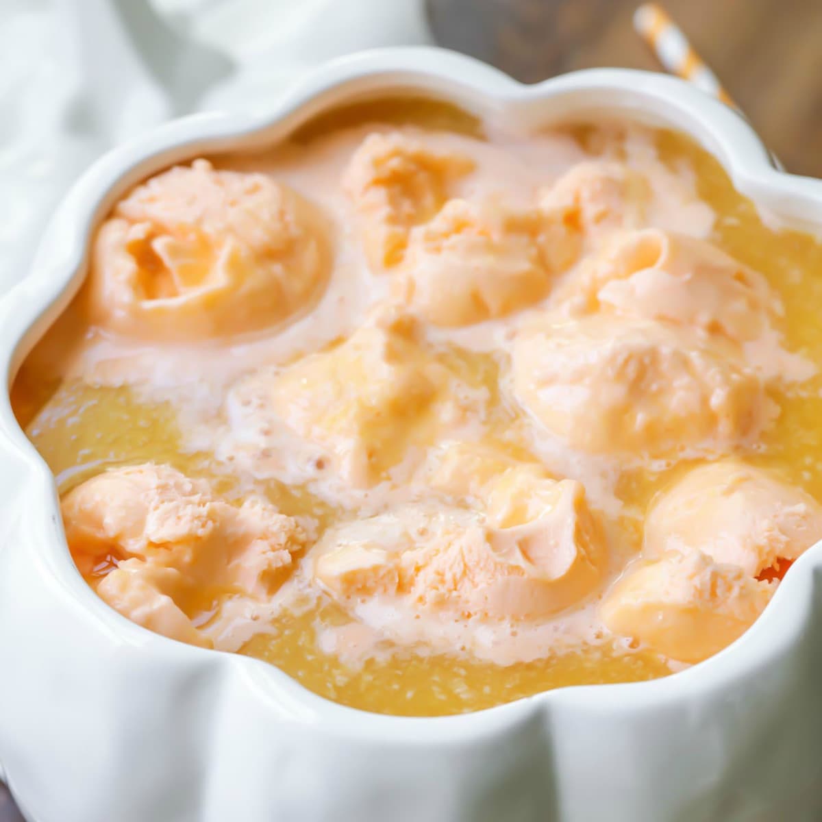 Halloween punch in a white pumpkin shaped punch bowl.