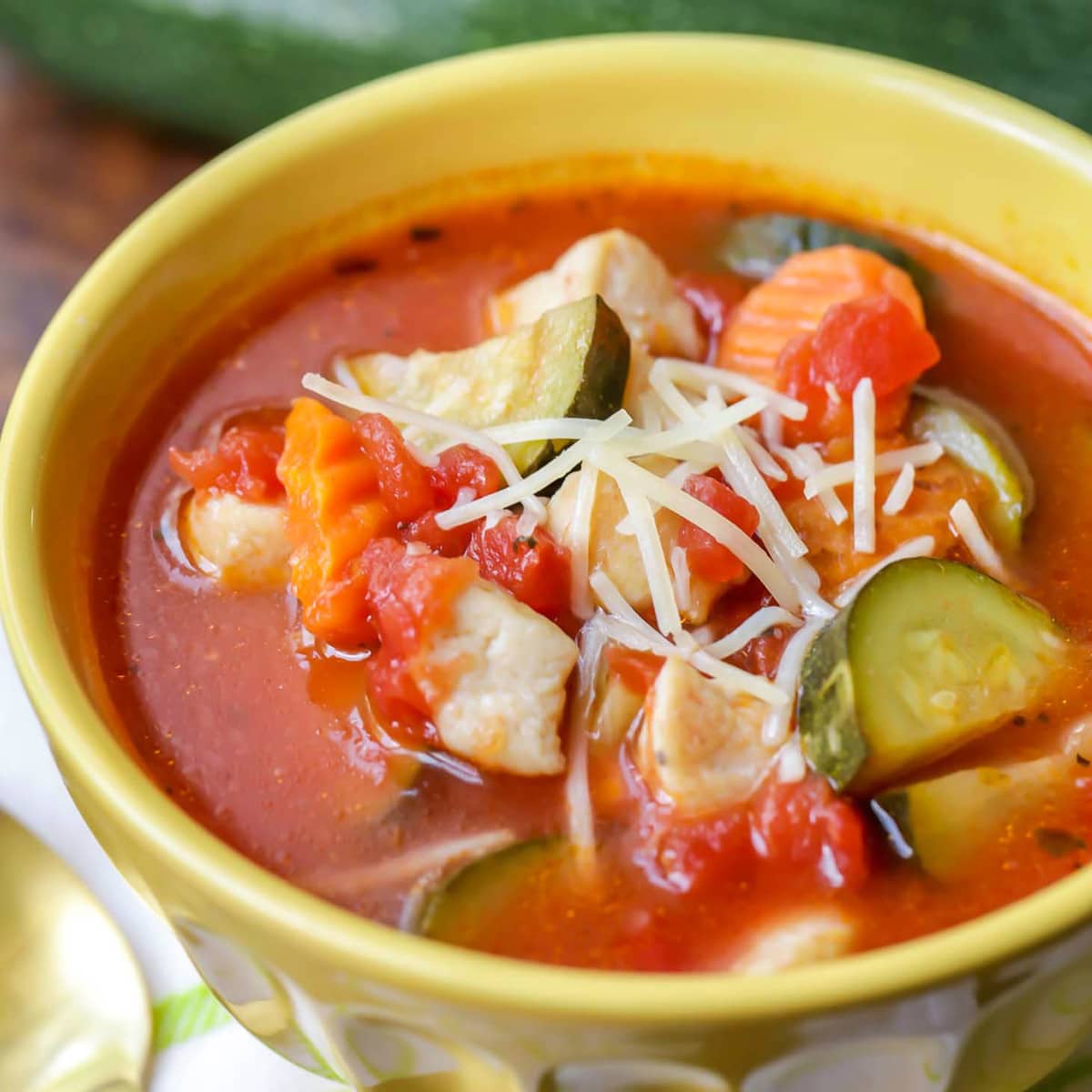 Healthy Soup Recipes  - Italian chicken and vegetable soup in a yellow bowl.