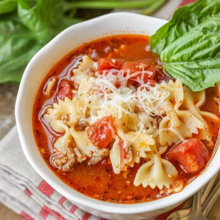 Italian Christmas Dinner ideas - a bowl of lasagna soup topped with shredded cheese.