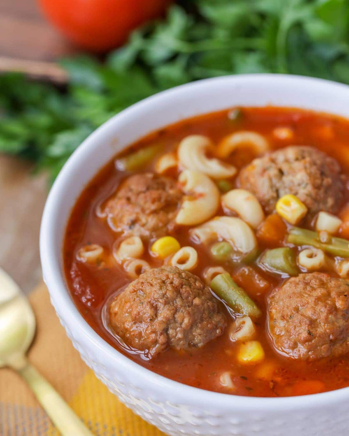 Italian Meatball Soup served in a white bowl