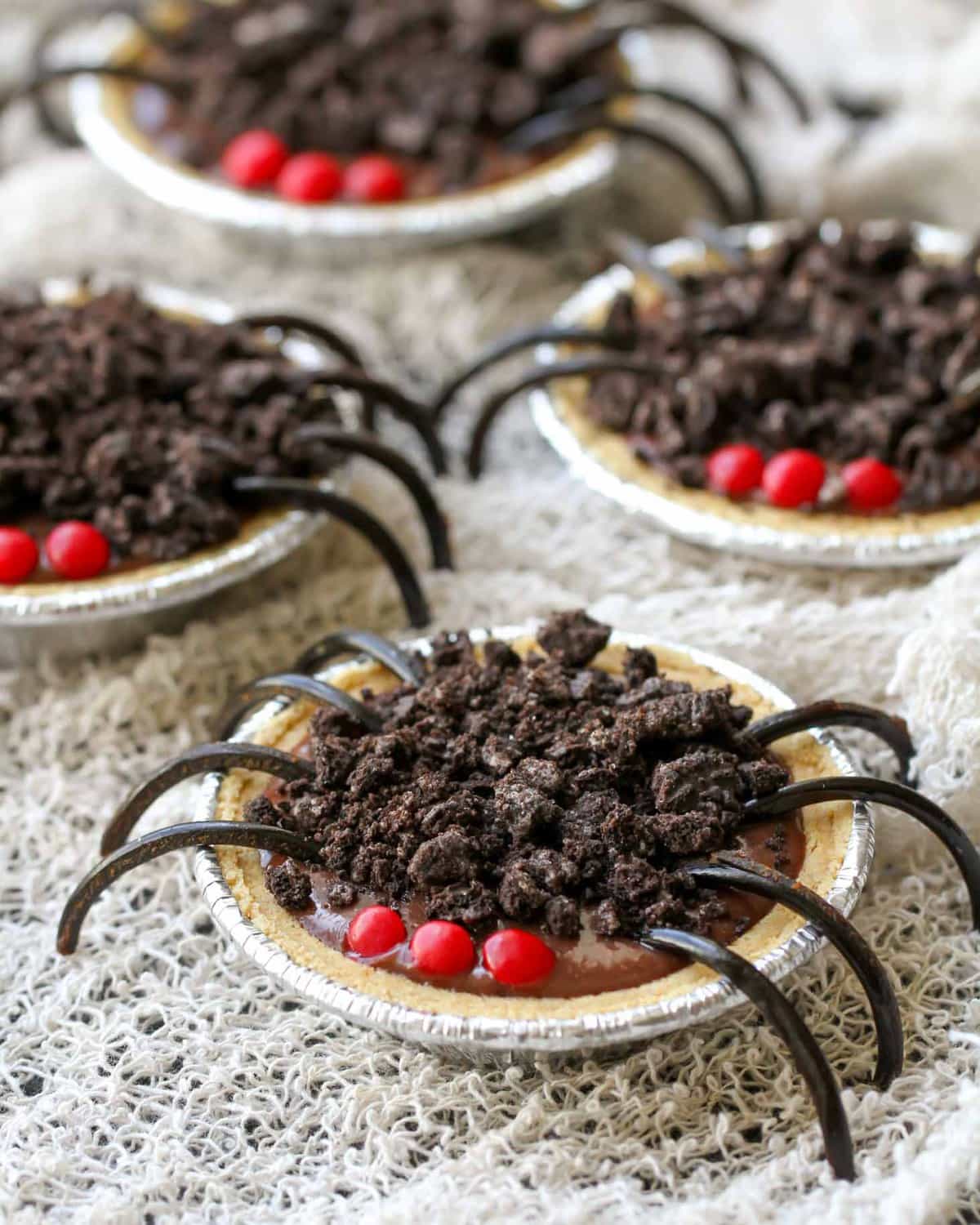 Halloween chocolate pudding pie spiders on a web cloth