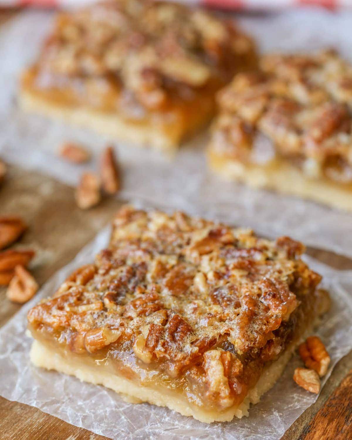 Easy Pecan Pie Bars sliced and placed on wax paper.