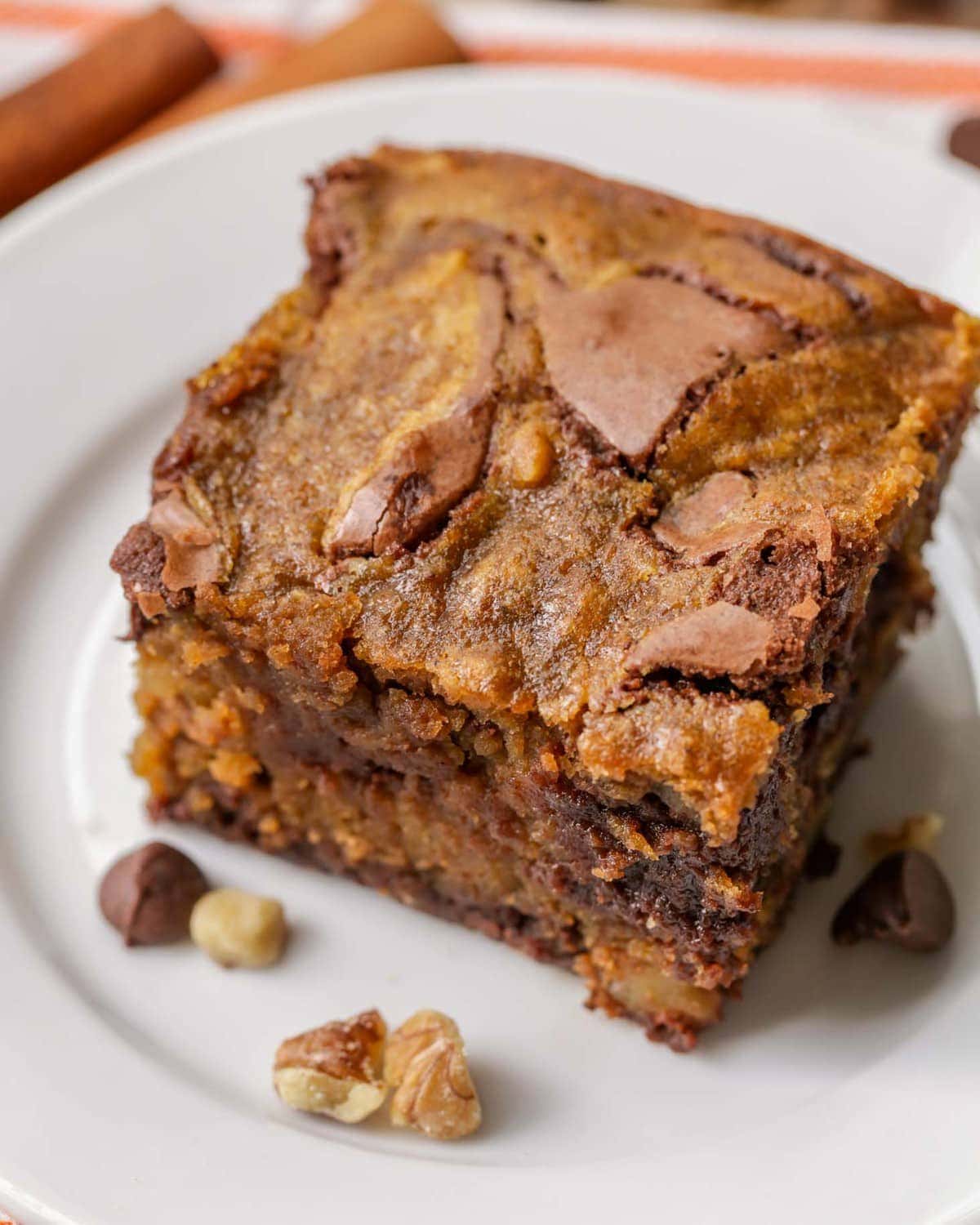 Pumpkin Brownies sliced and served on a white plate.