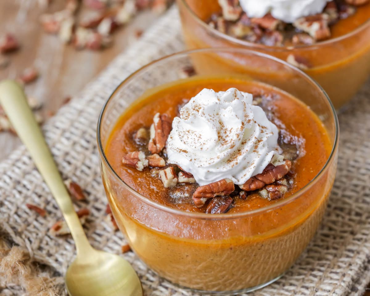 Pumpkin recipes - glass of pumpkin custard topped with whipped cream.