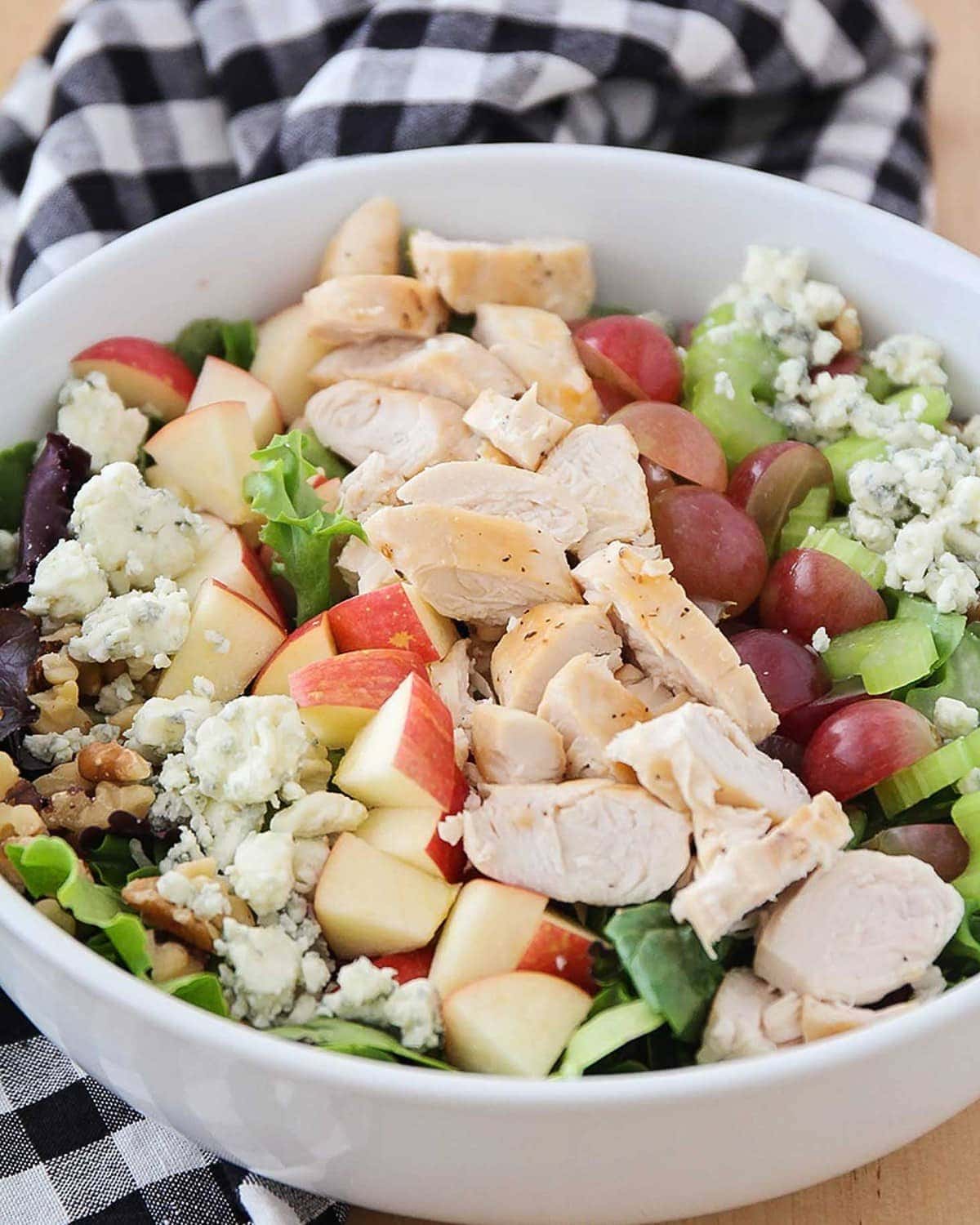 Waldorf Salad Recipe served in a white bowl.