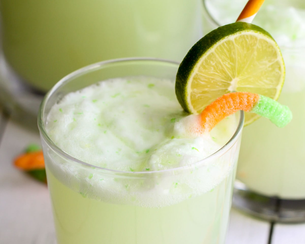 Frozen drink recipes - witches brew in a glass with a lime garnish.
